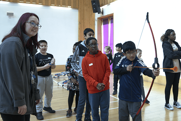 Children doing archery at YMCA HAF holiday club in Wolverhampton