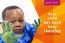 child looking to camera with his paint covered hands in the air. Text on image reads BLOG POST Your Child has been busy learning